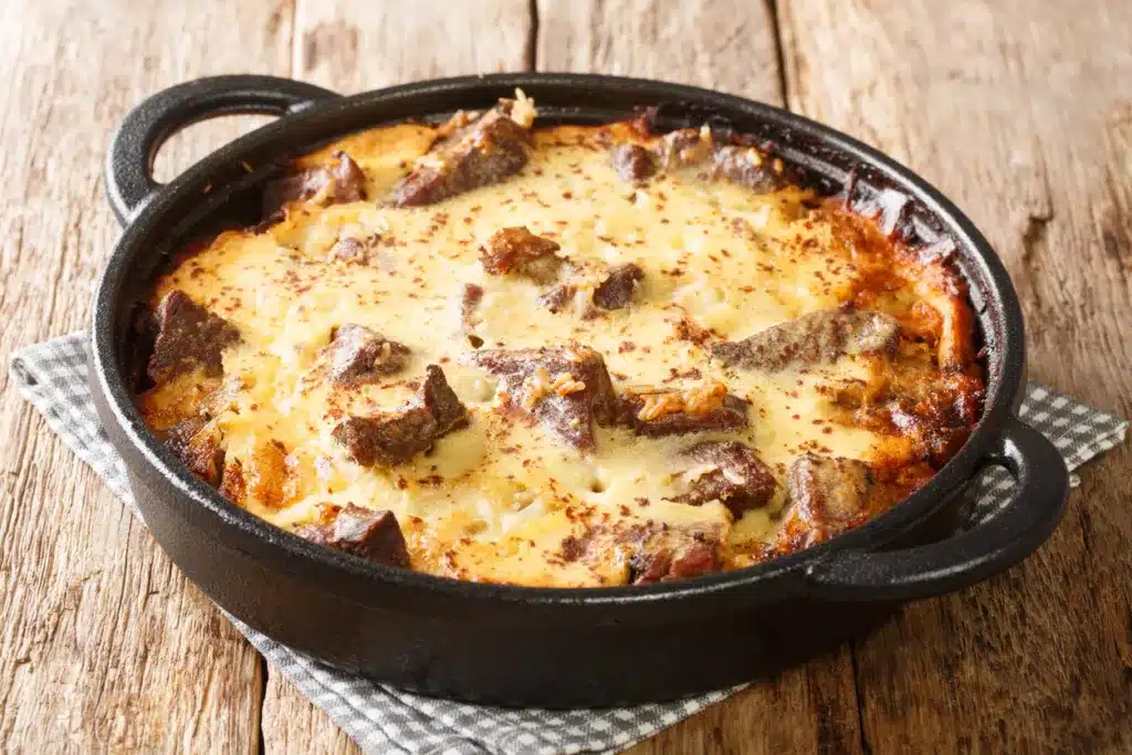 Traditional Albania Food_Tave-Kosi the national dish baked meat and yoghurt